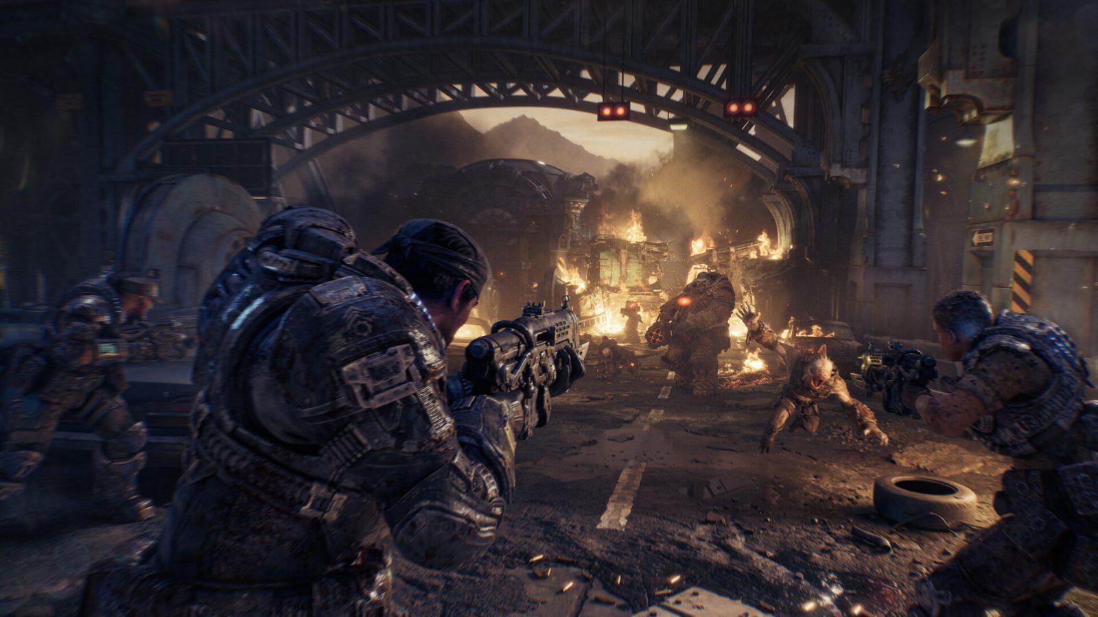 COG soldiers take cover and fire at Locust forces under a burning bridge in Gears of War: E-Day