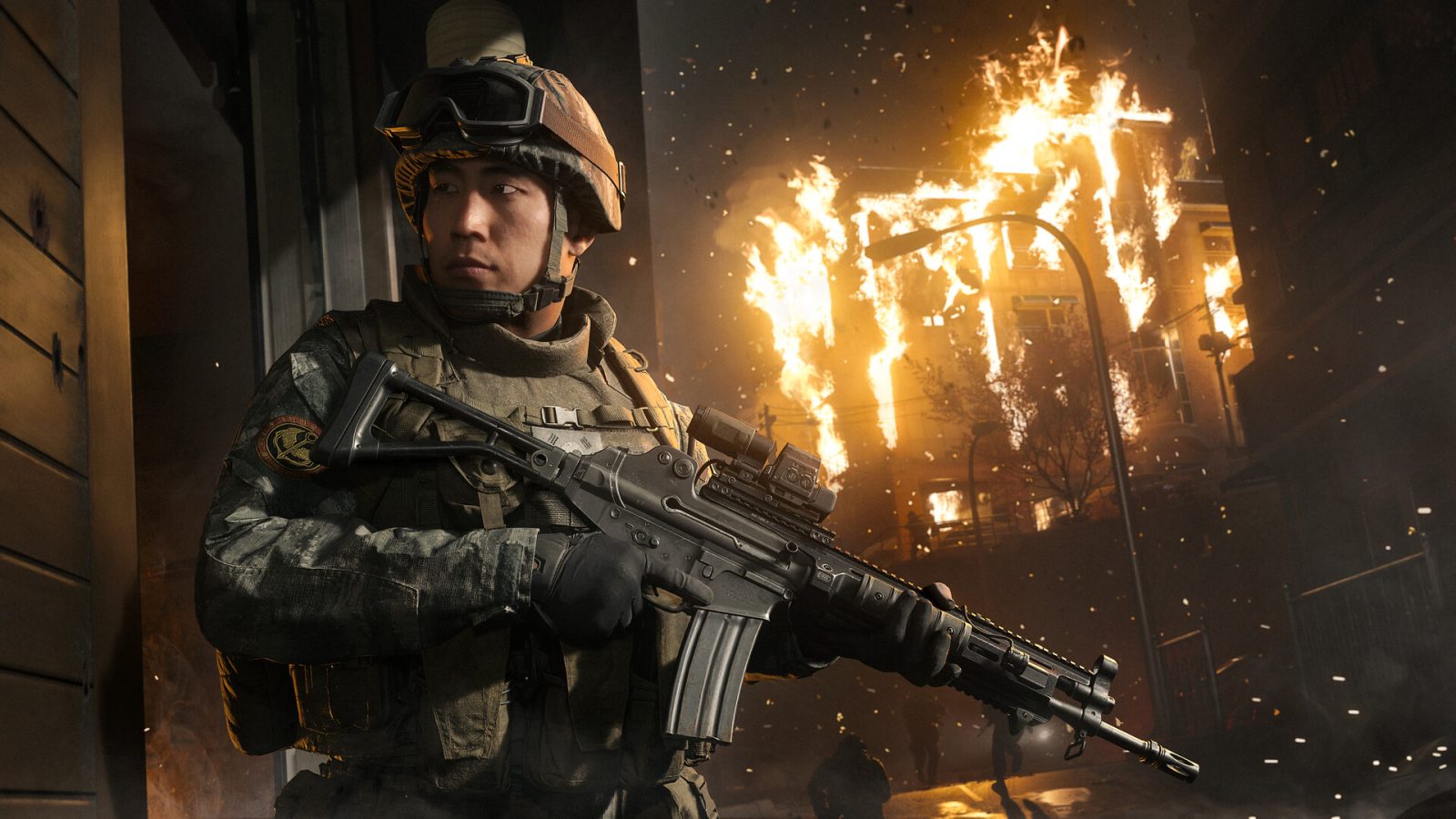 A soldier in tactical gear holds a rifle in front of a burning building in Call of Duty: Modern Warfare 4